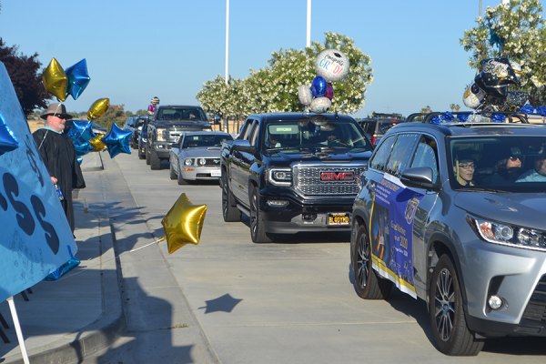 A caravan of Lemoore Middle College High School students rolls up as students receive their diplomas Wednesday night (May 21) at West Hills Community College.